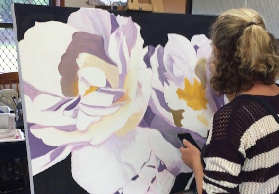 Sharran Working On a A Painting of Flowers